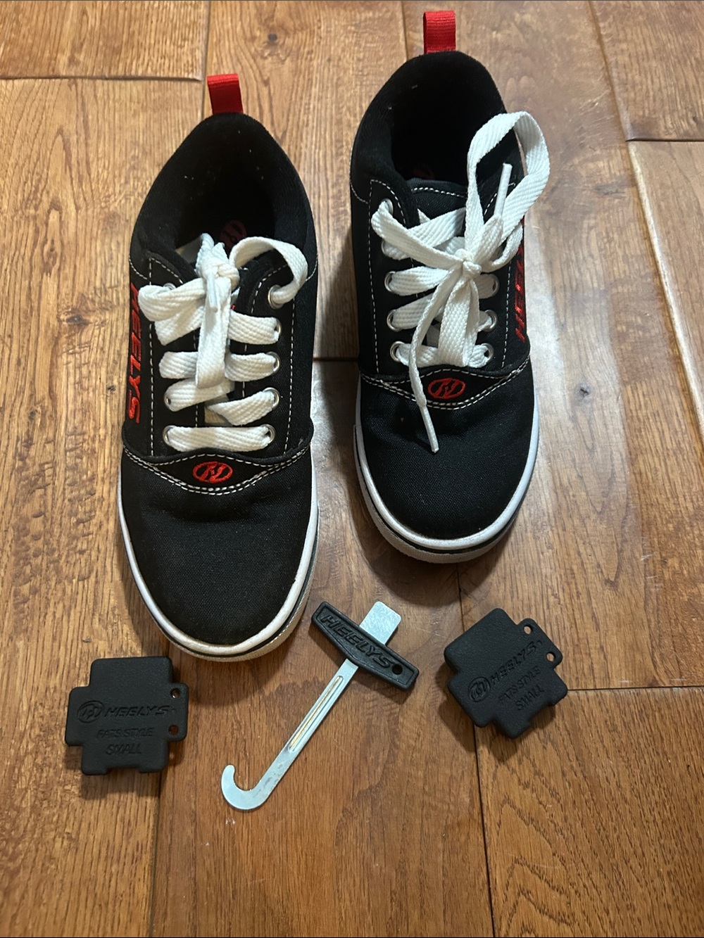 Heelys Black Shoes with White Laces and Red Accents